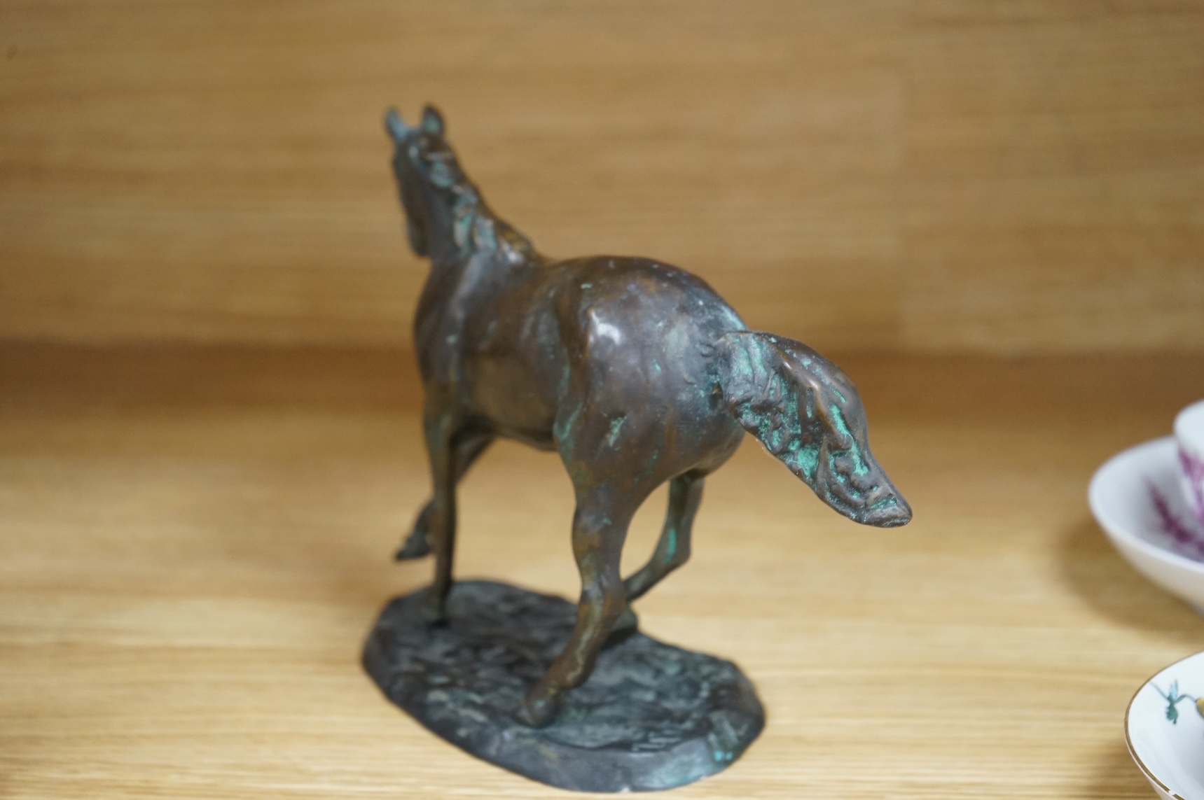 A bronze model of a horse, 23cm wide